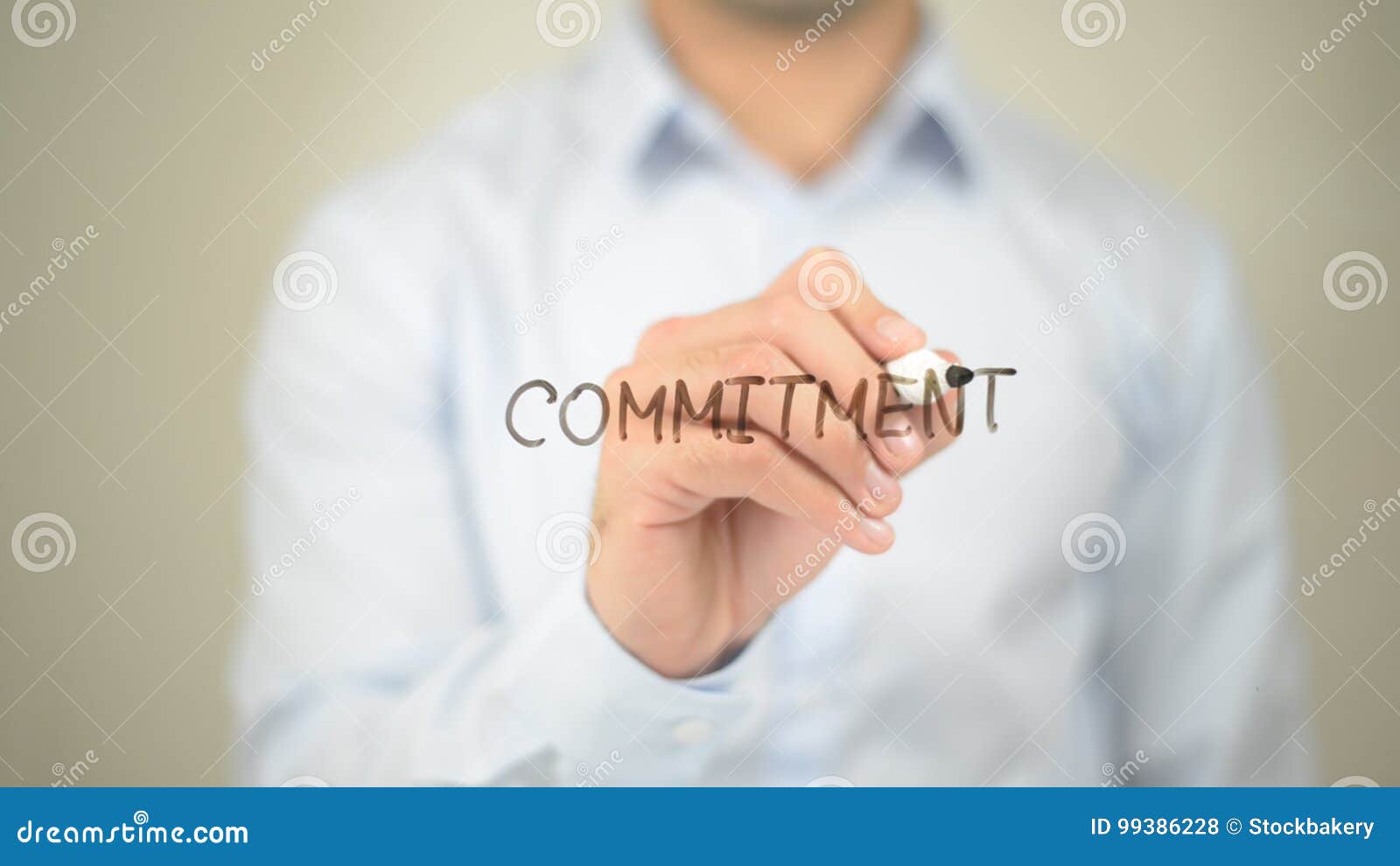 commitment, man writing on transparent screen