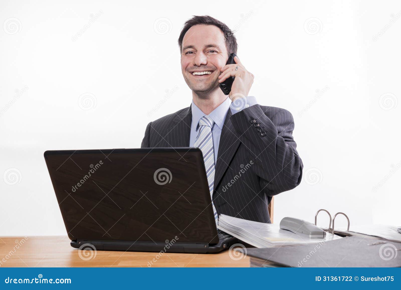 committed employee smiling at phone