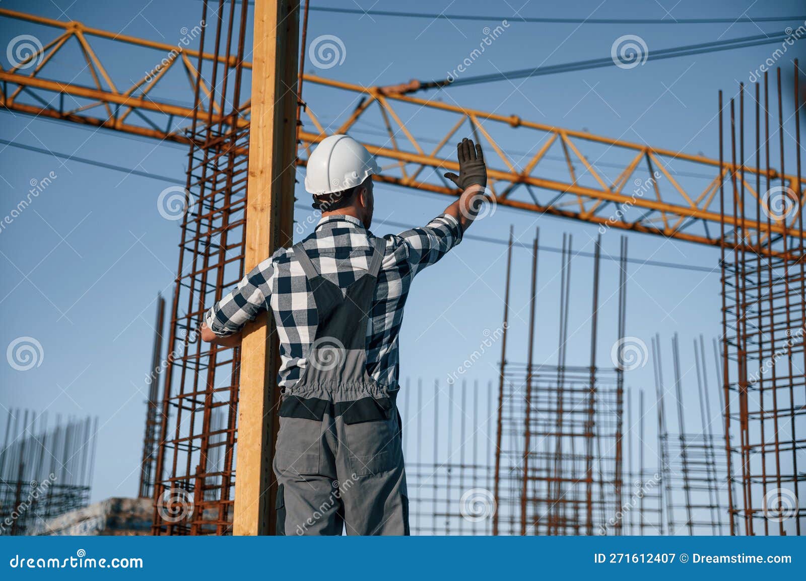 Communicating with Other People. Man is Working on the Construction