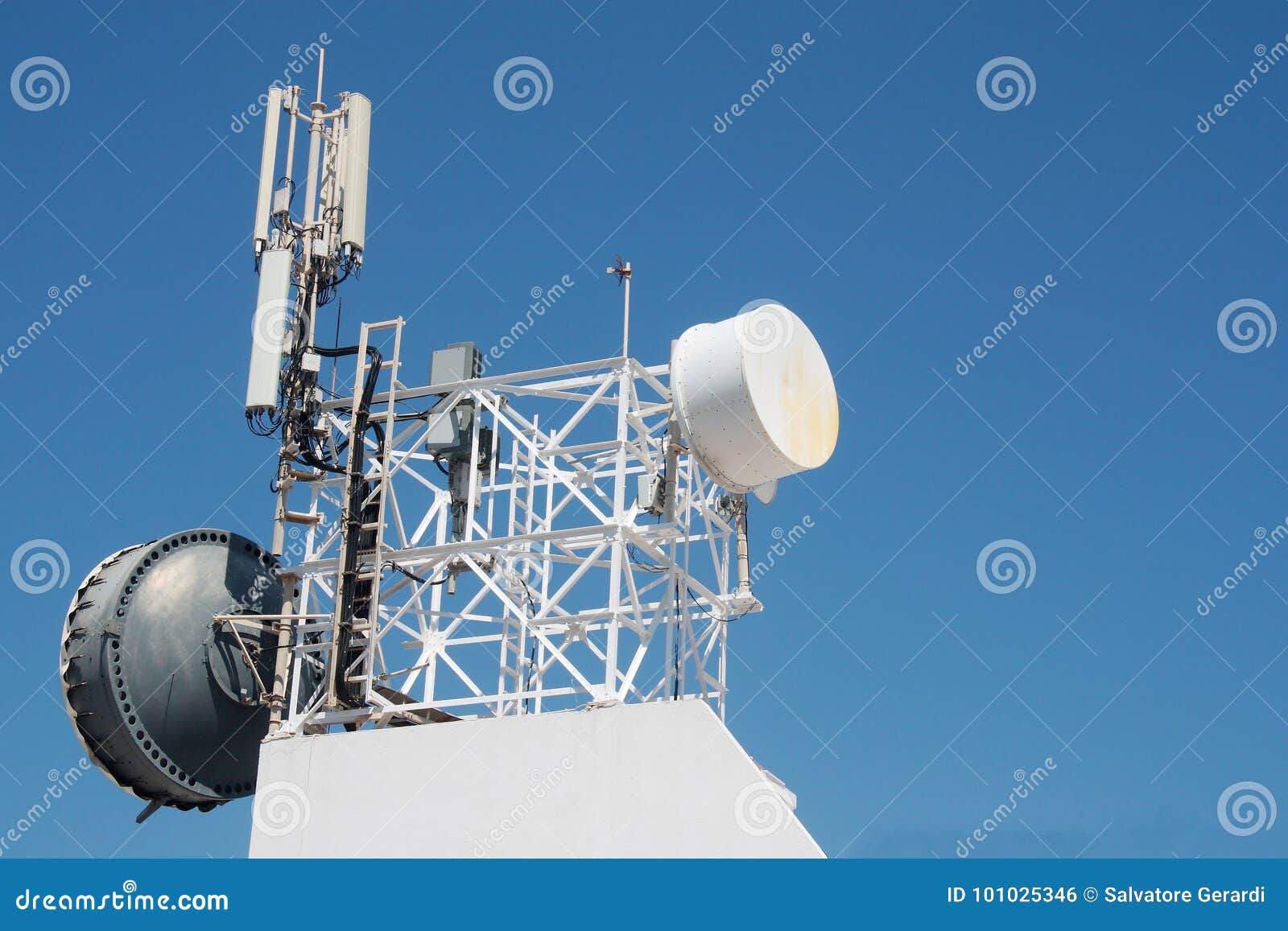 Communication Antenna Repeater Mounted on a Building Stock Photo