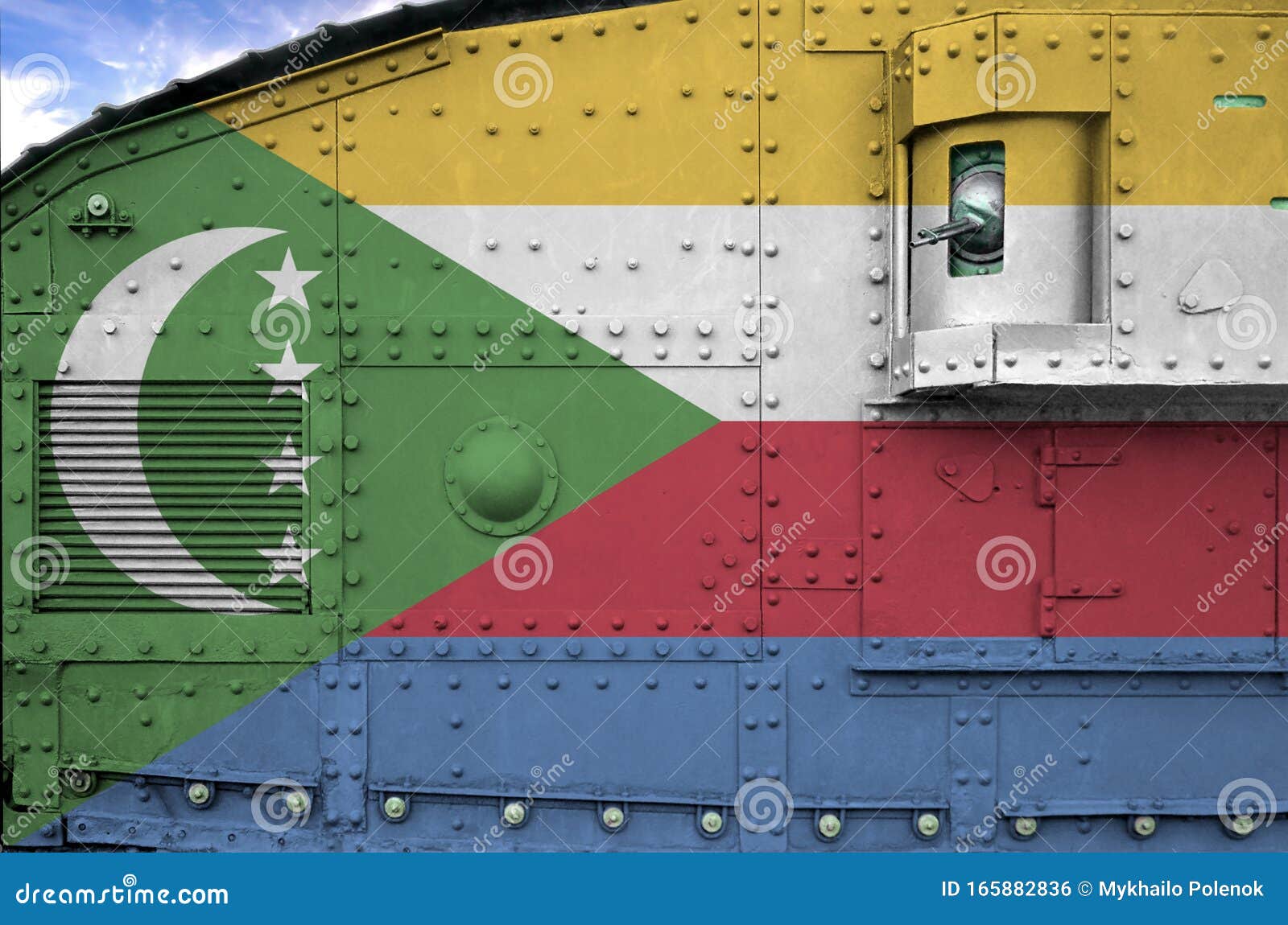 comoros flag depicted on side part of military armored tank closeup. army forces conceptual background