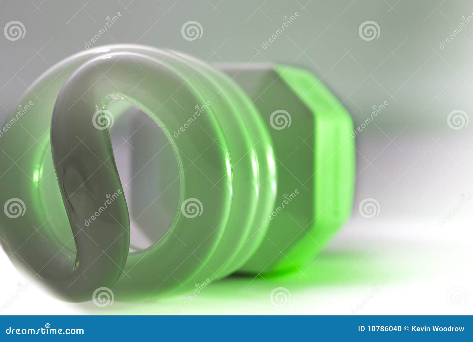 Compact Fluorescent Light with Green Glow Stock Photo Image of white