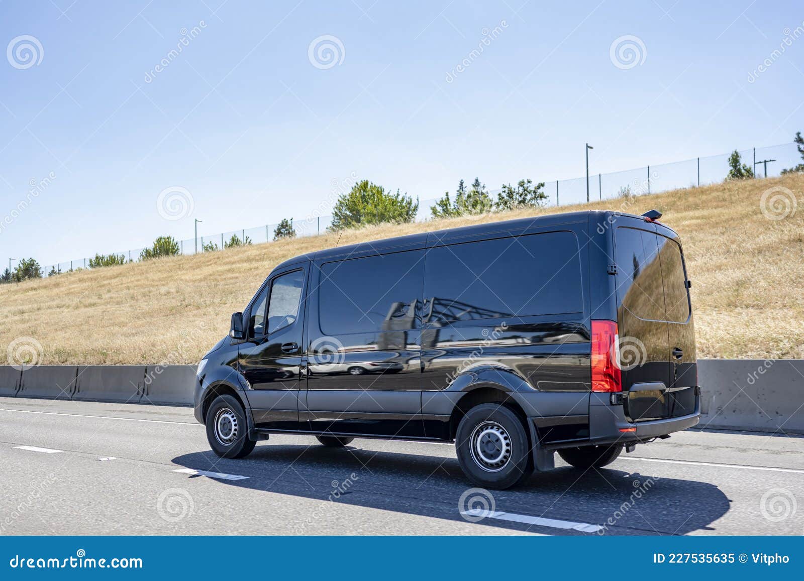 Black Compact Commercial Mini for Small Business and Local Delivery Running on the Highway Road To Point of Stock Image - of driving, commercial: 227535635
