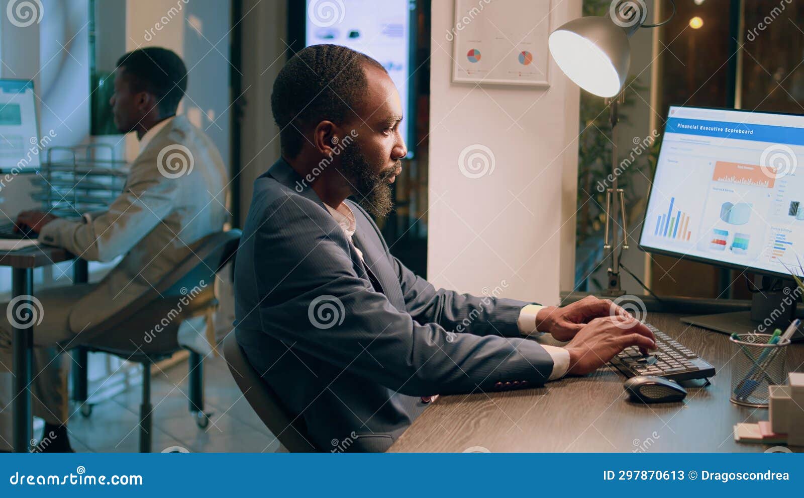 company personnel sitting at office desk