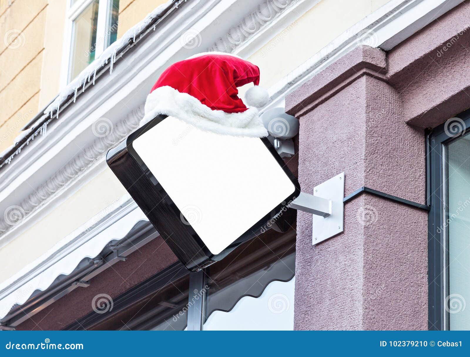 Download Company Signage Decorated With Santa Hat During Christmas ...