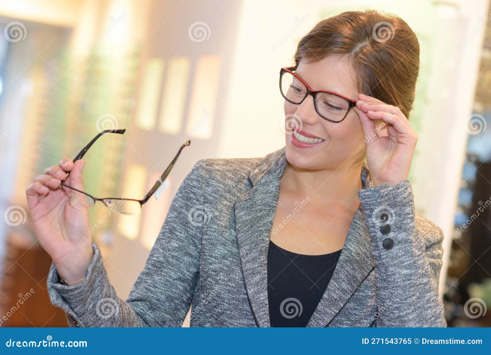 She comparing glasses stock image. Image of appointment 271543765