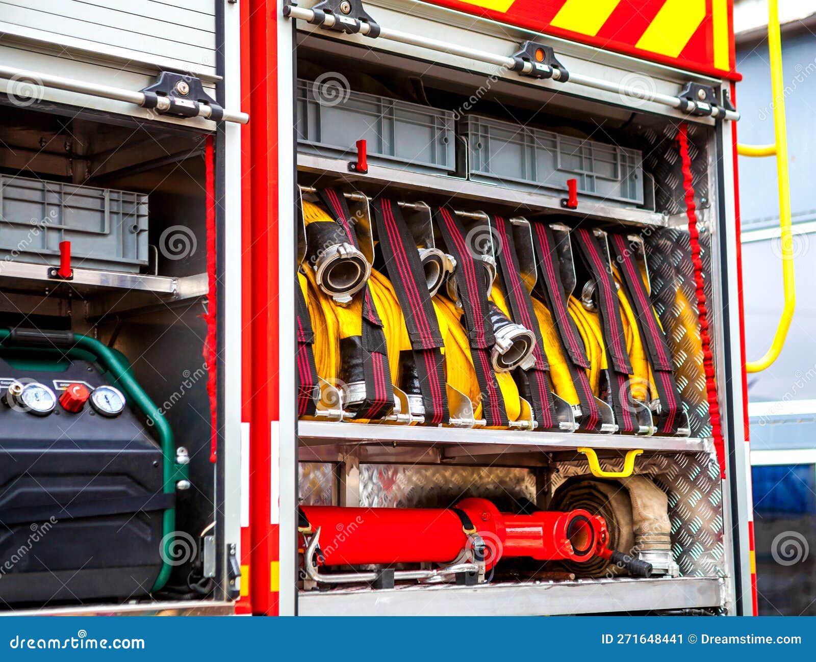 Compartment of Rolled Up Fire Hoses on a Fire Engine. Rescue Fire Truck
