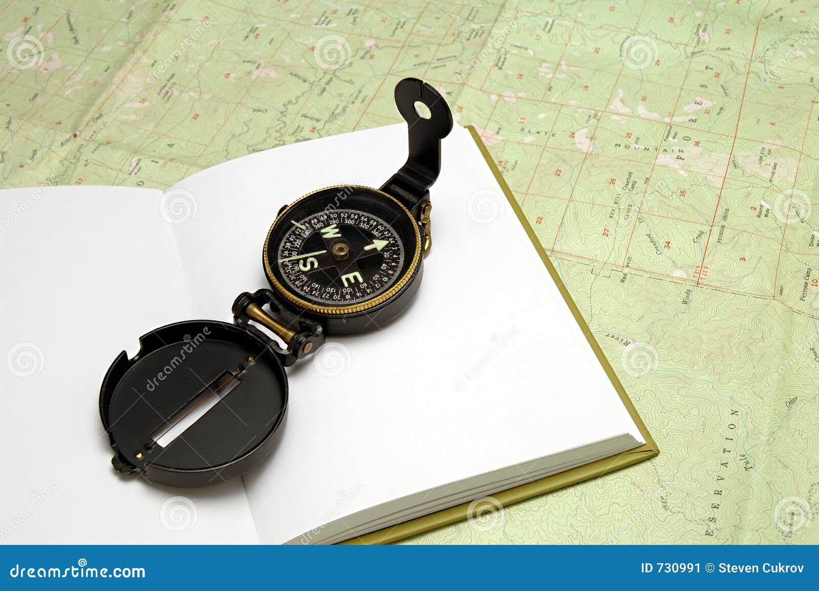 Compass on Journal stock image. Image of south, west, explore 730991