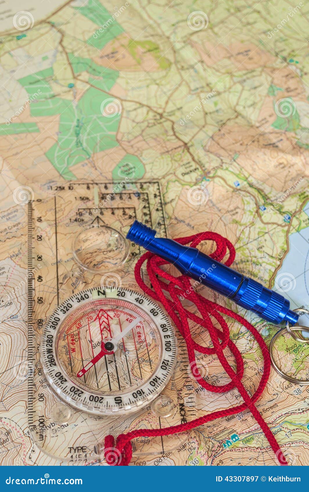 Compass On Map And Rescue Whistle RoyaltyFree Stock Photo