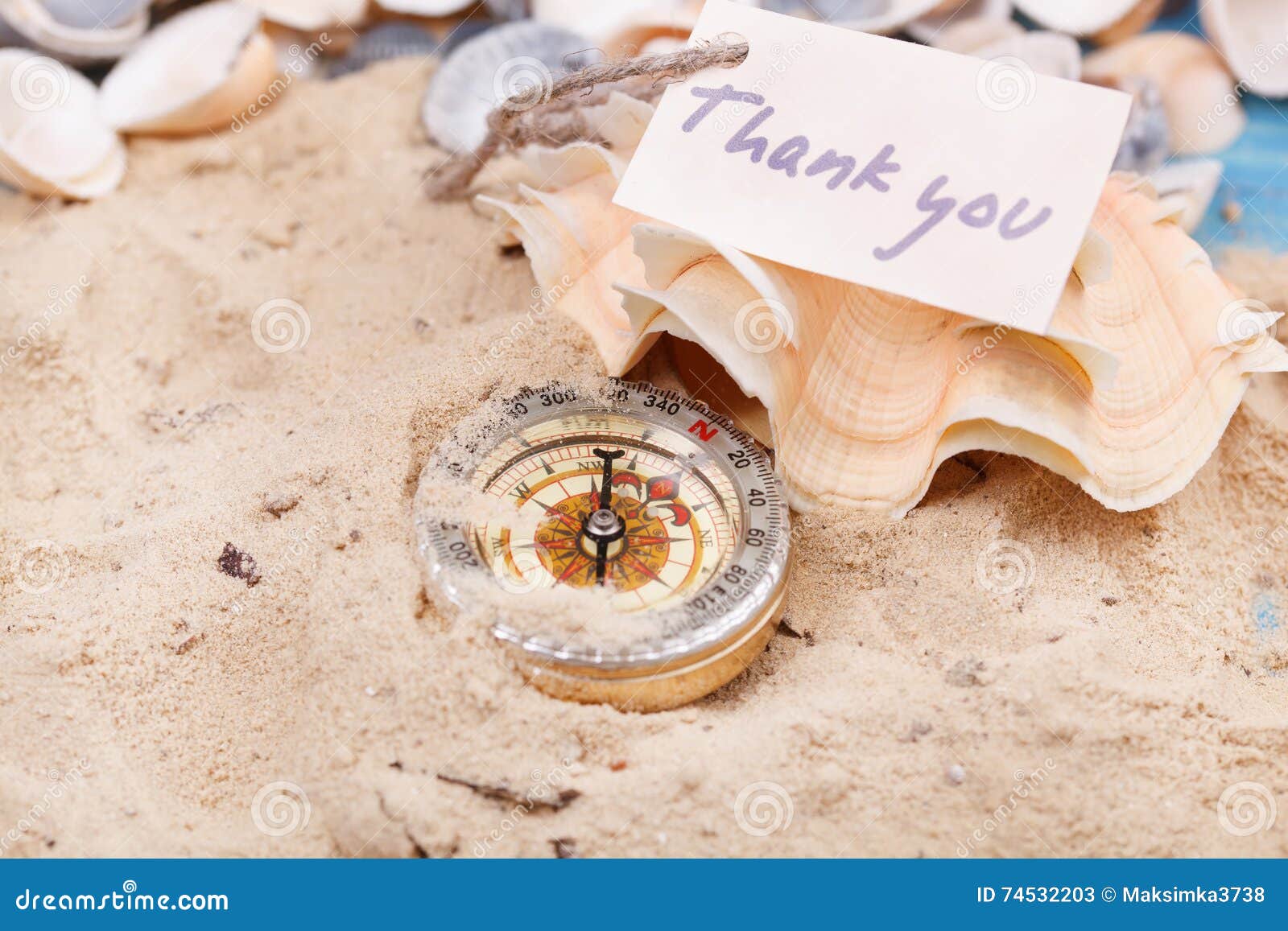 compass in the sand with message thank you stock image image of thank you sand