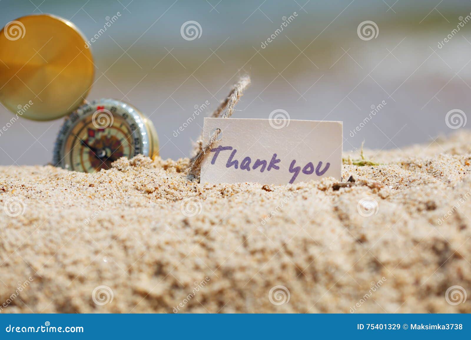 Compass in the Sand with Message Thank You Stock Image Image of