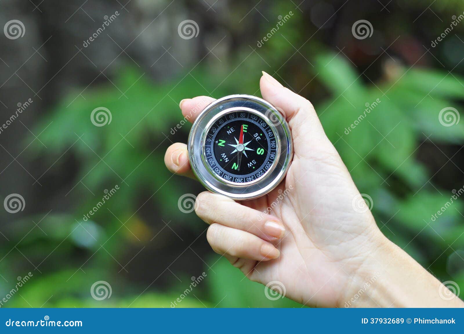 compass in woman hand