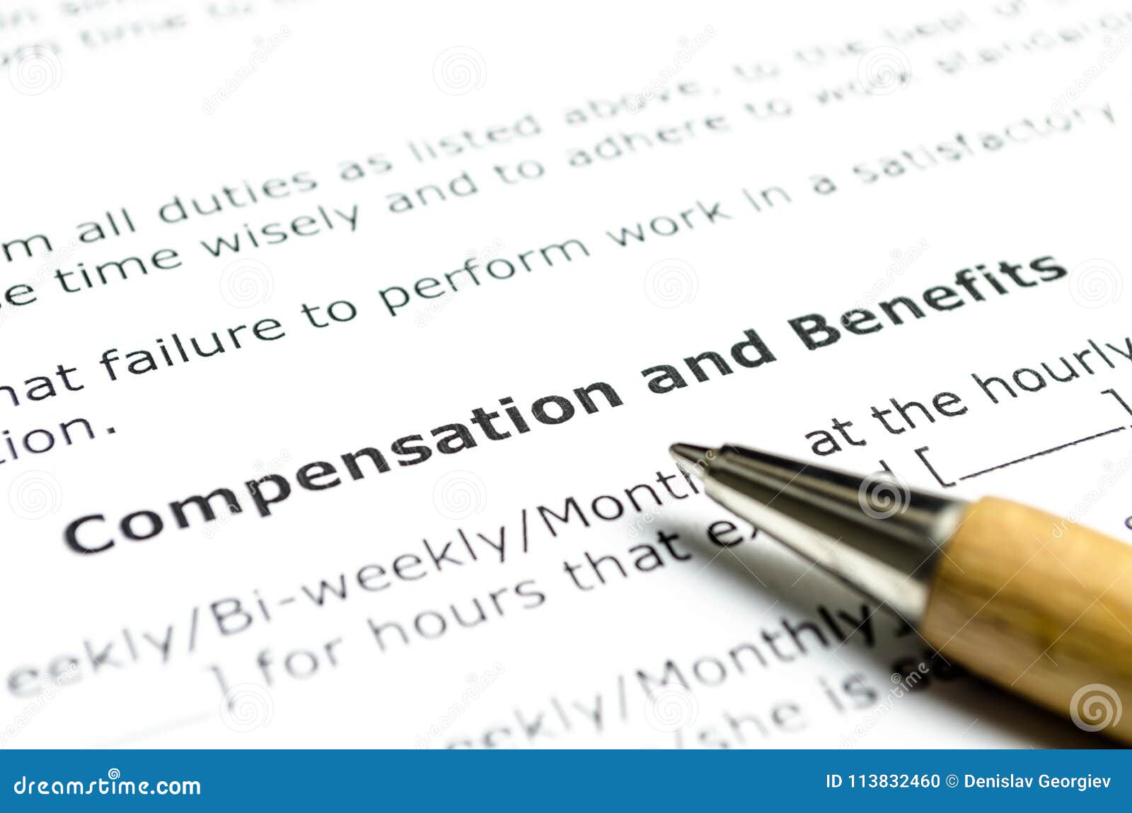 compensation and benefits with wooden pen