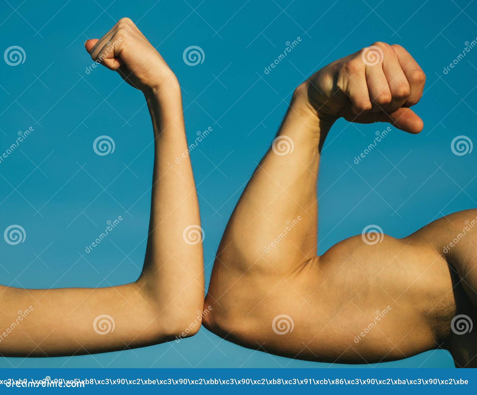 competition, strength comparison. vs. fight hard. health concept. hand, man arm, fist. musclar arm vs weak hand