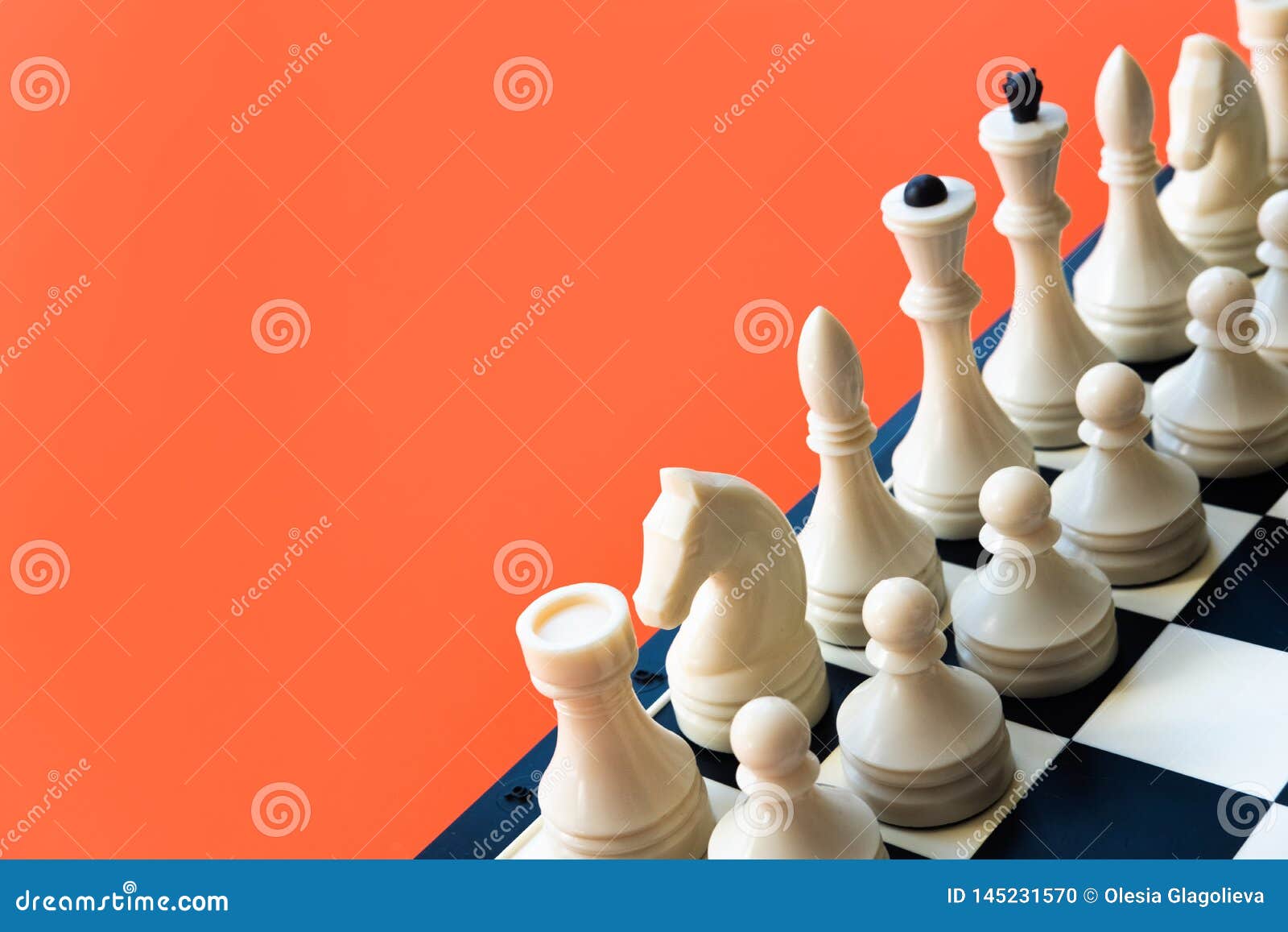 Chess Game Concept. Chess Board with Figures on Orange Background