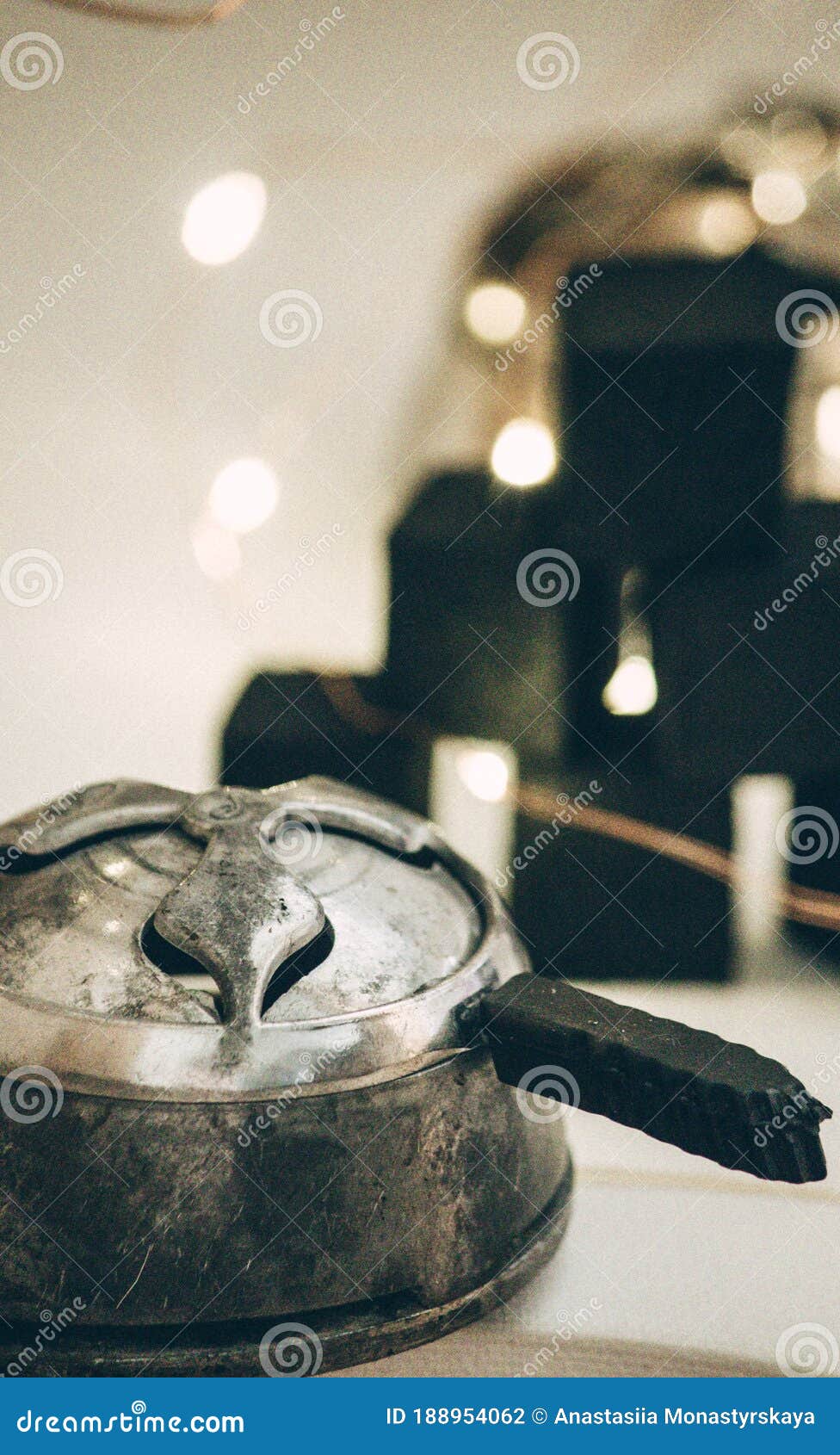 Component of a Hookah on a Background of Coals and Lights. Stock Photo
