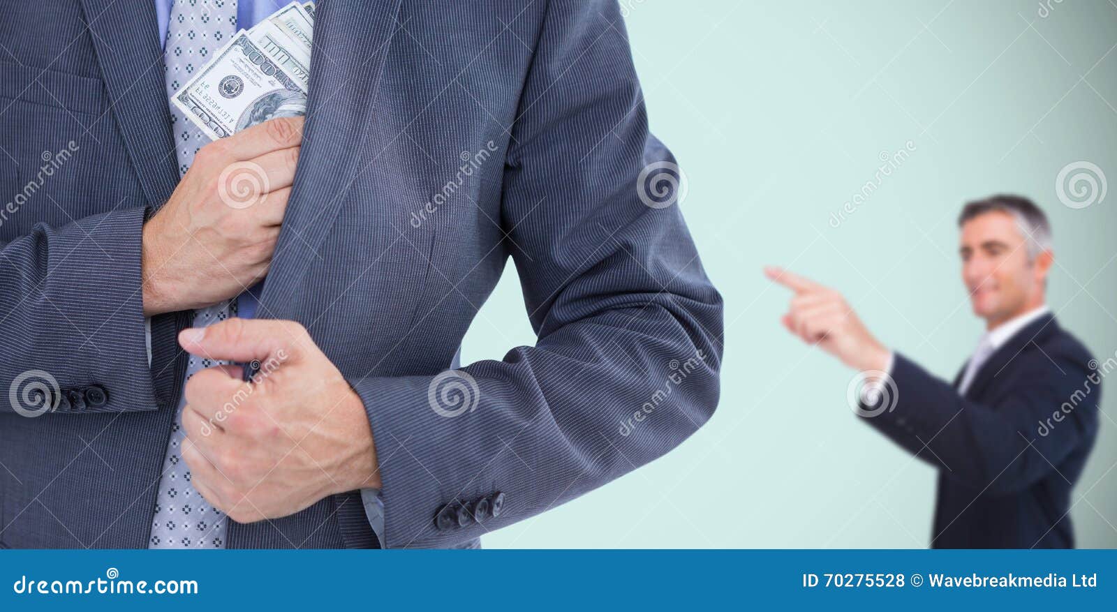 Composite Image of Businessman Keeping Money in Jacket Stock Photo