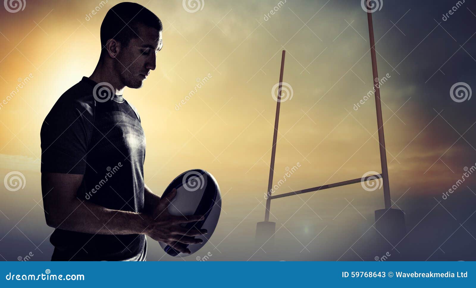 Composite Image of Calm Rugby Player Thinking while Holding Ball Stock