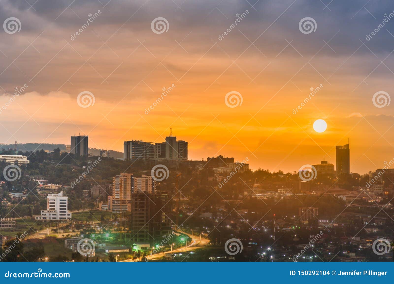 a composite image of kigali city centre skyline and surrounding in daylight, sunset and at night. rwanda