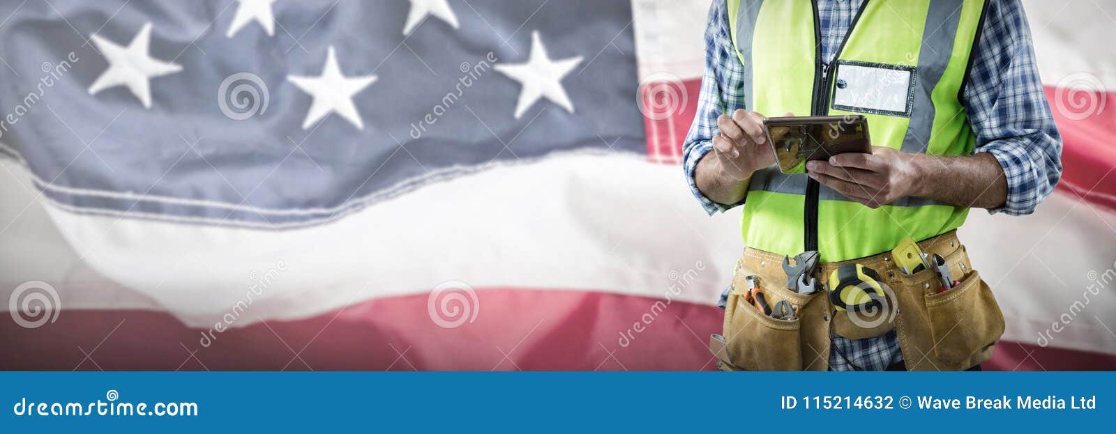 Composite Image of Midsection of Construction Worker Using Tablet