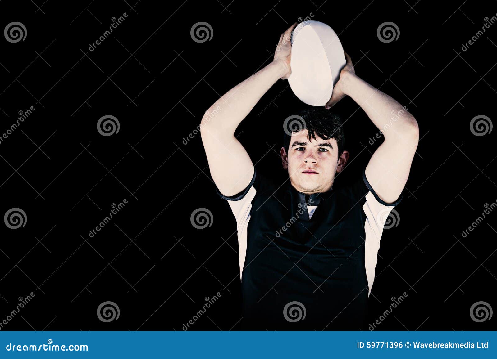 Portrait Of Rugby Player Wearing Helmet With Arms Crossed RoyaltyFree