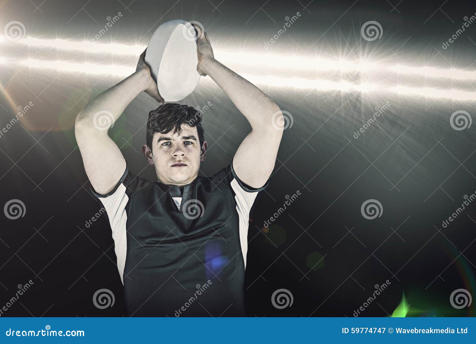 Portrait Of Rugby Player Wearing Helmet With Arms Crossed RoyaltyFree Stock Photo