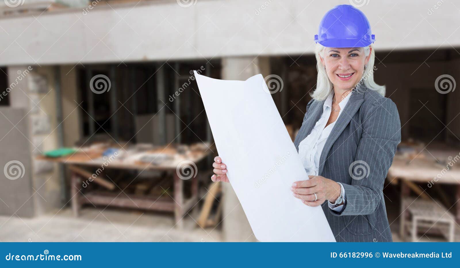 composite image of selfassured businesswoman wearing a helmet