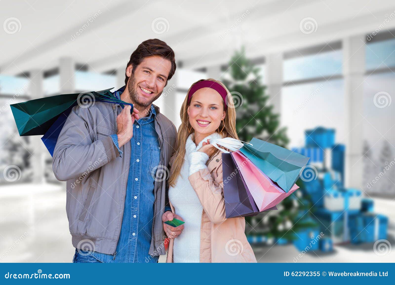 Composite image of smiling couple with shopping bags in front of window. Smiling couple with shopping bags in front of window against home with christmas tree