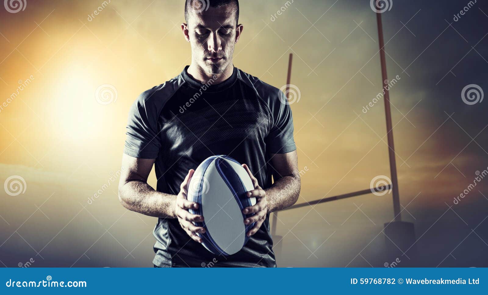 Composite Image of Thoughtful Rugby Player Holding Ball Stock Photo