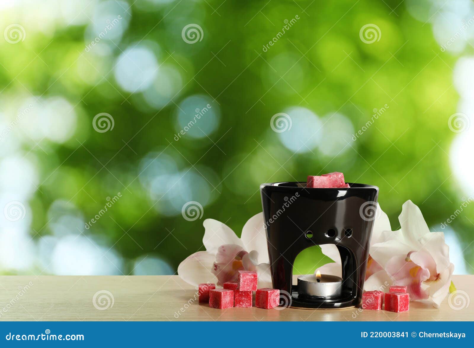 Composition with Aroma Lamp on Wooden Table Outdoors, Space for Text