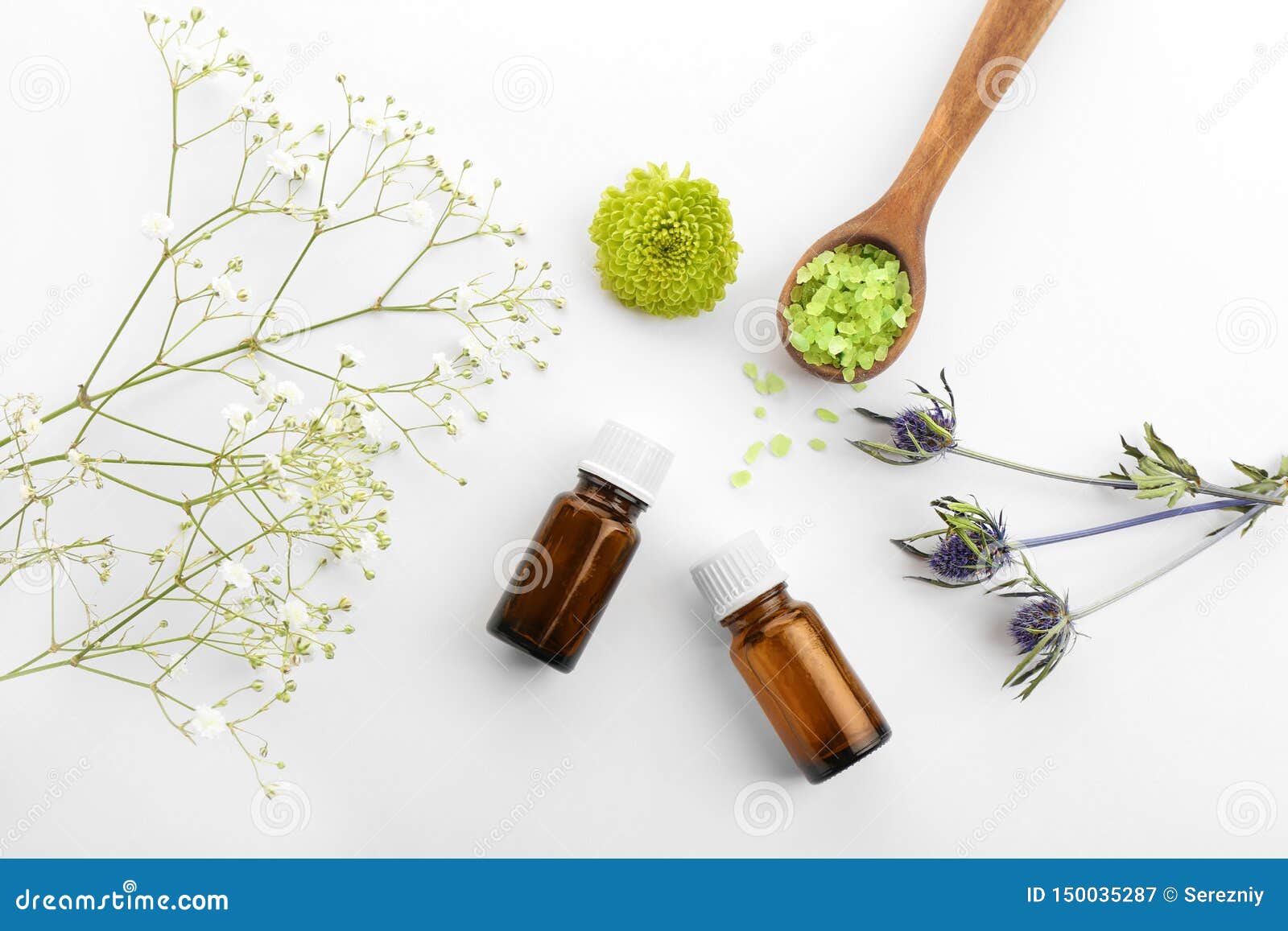 Composition With Bottles Of Essential Oils On White Background. Natural