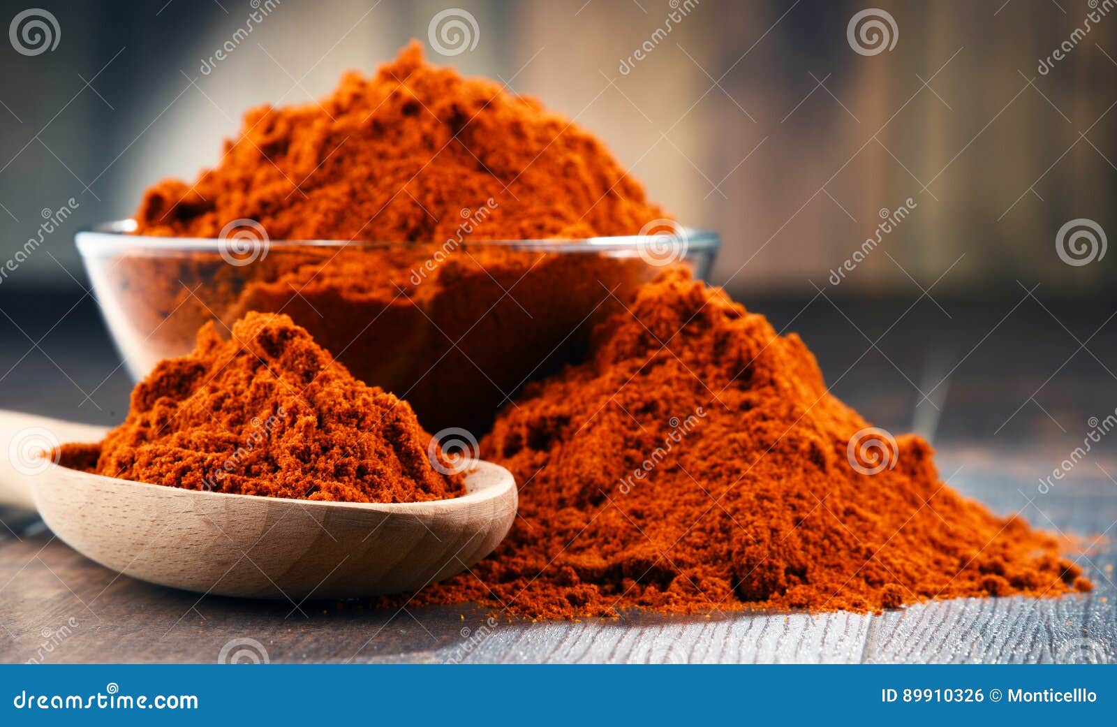 Composition with Bowl of Chili Powder on Wooden Table Stock Photo