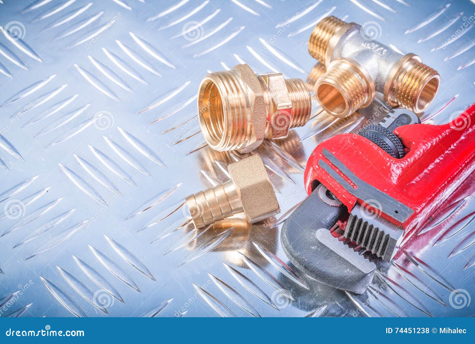 Composition of Brass Hardware on Grooved Metal Plate Plumbing Co Stock