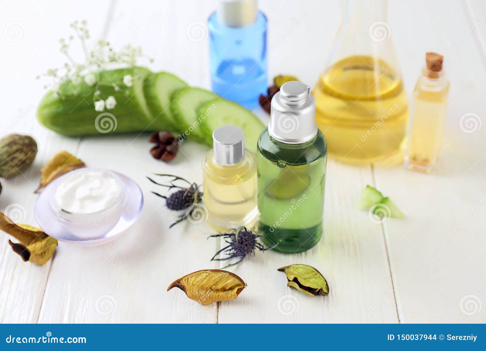 Composition with Essential Oils on Wooden Background Stock Photo