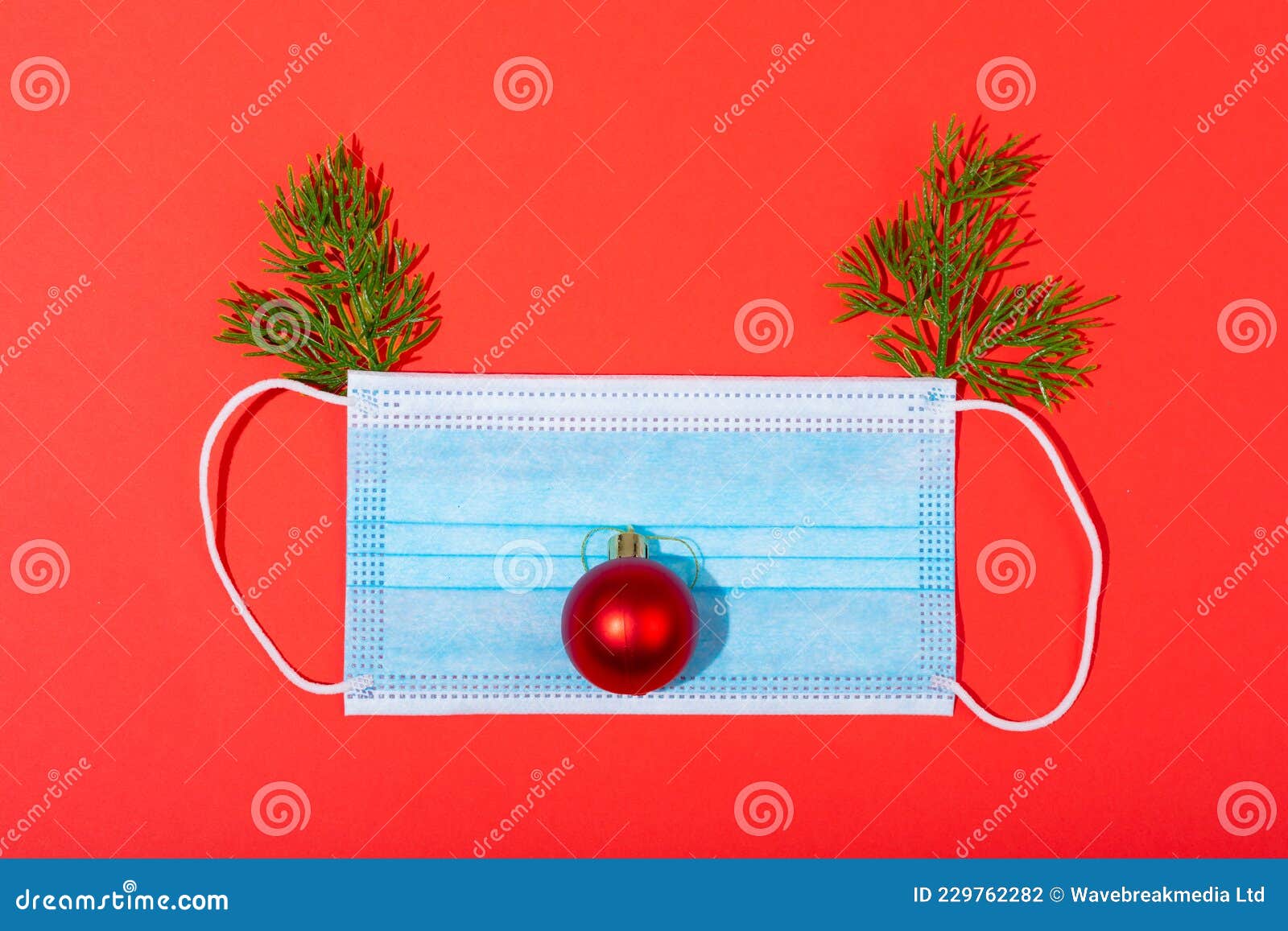 Composition of Face Mask with Christmas Decorations in Shape of