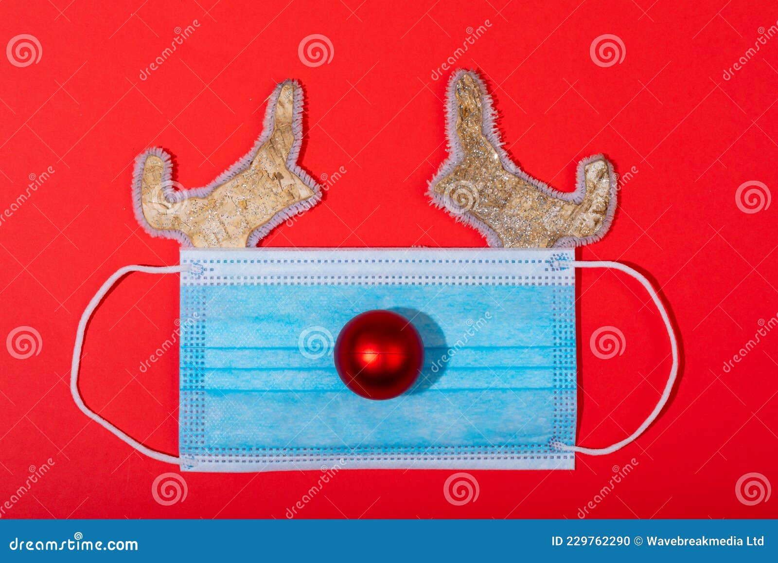 Composition of Face Mask with Christmas Decorations in Shape of
