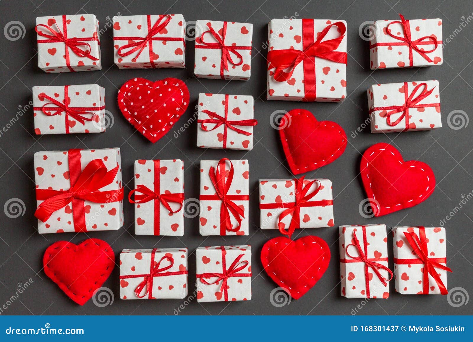 Composition of Holiday White Gift Boxes and Red Textile Hearts on ...
