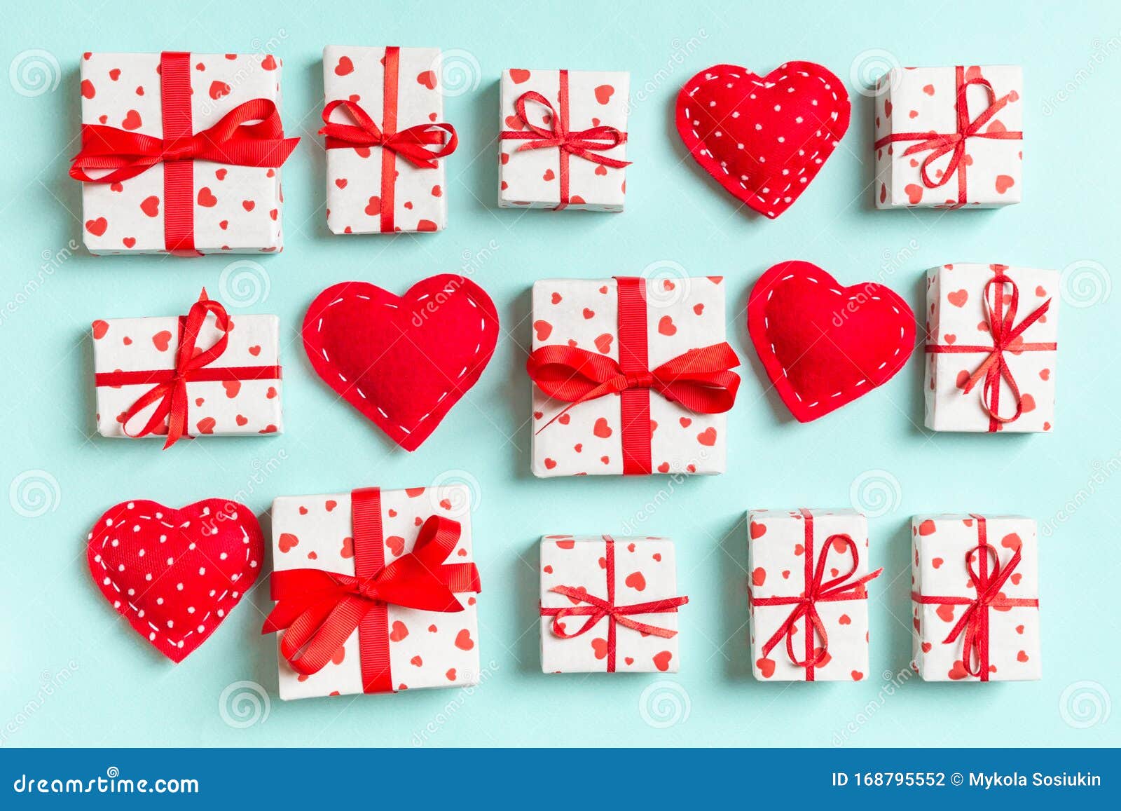 Composition of Holiday White Gift Boxes and Red Textile Hearts on ...