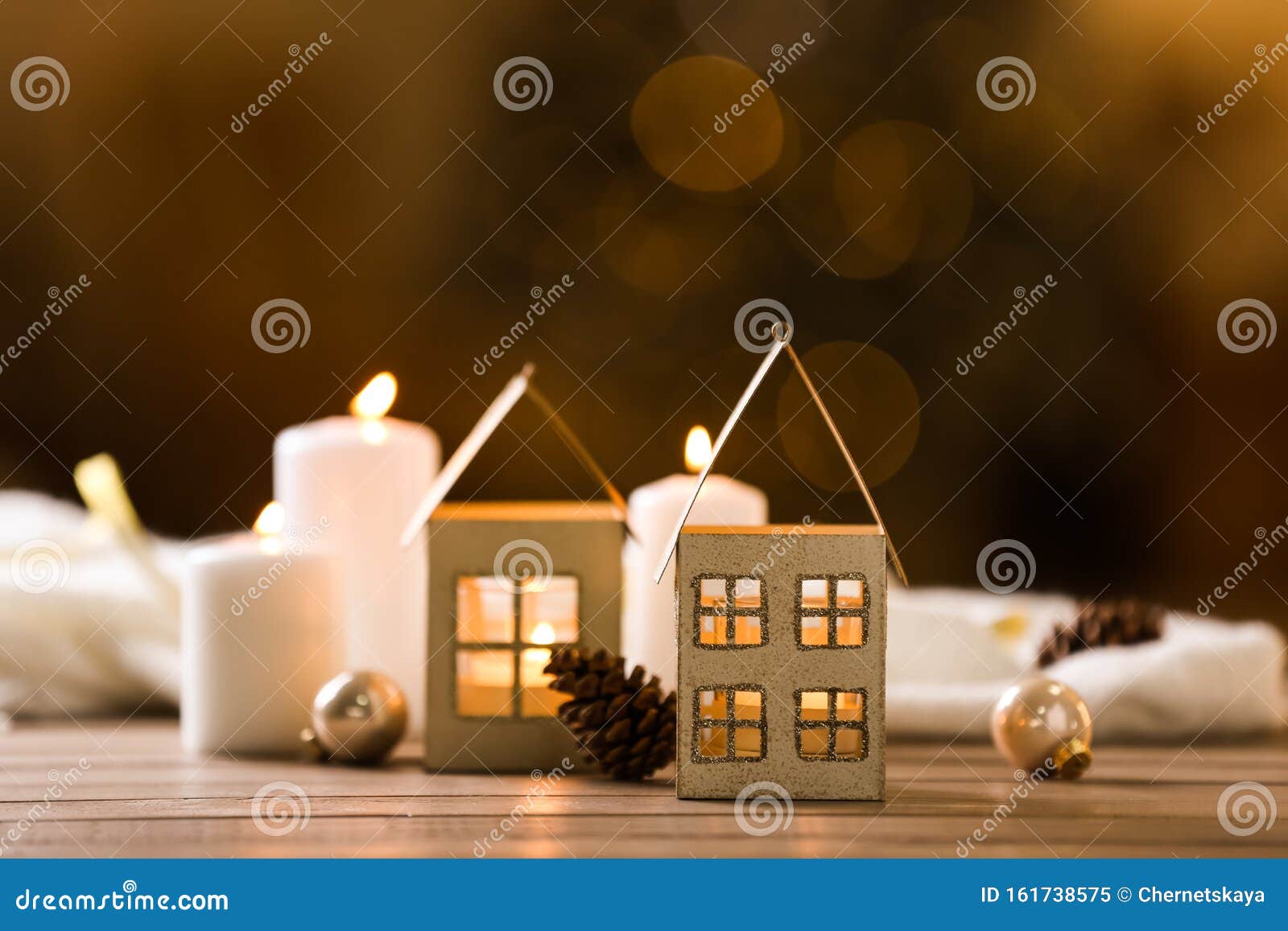 Composition With House Shaped Candle Holder On Table Against Blurred ...