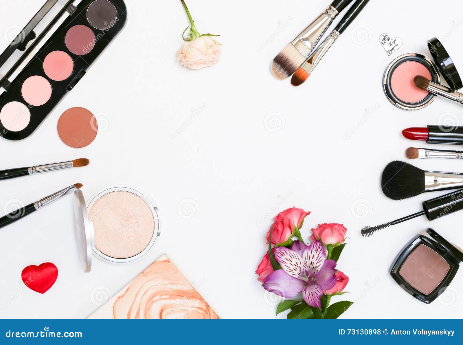 Composition with Makeup Cosmetics, Brushes, Shadoes and Flowers on