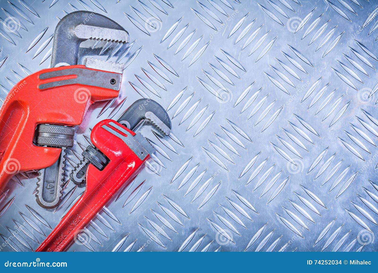 Composition of Pipe Wrenches on Grooved Metal Plate Construction Stock