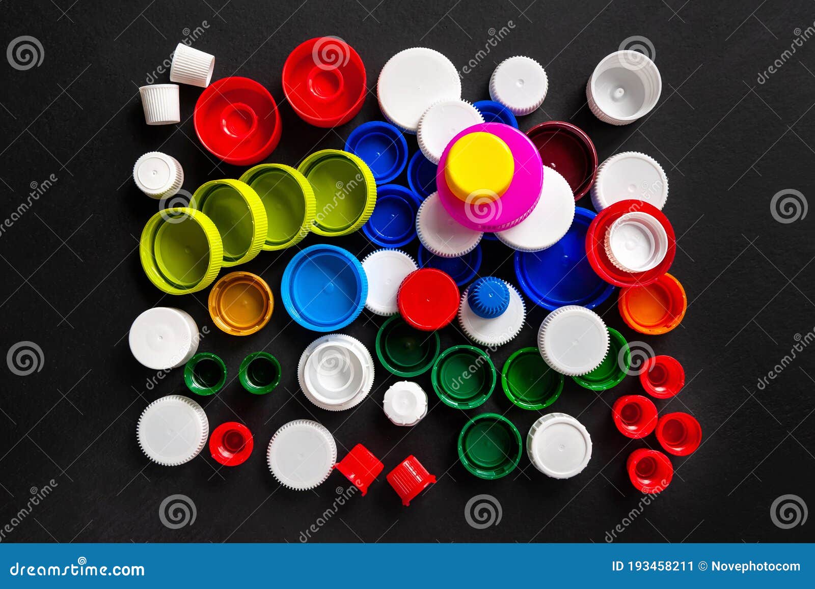 Download Composition Of Plastic Caps On A Black Background. Top View Of Recycled Plastic Bottle Caps ...
