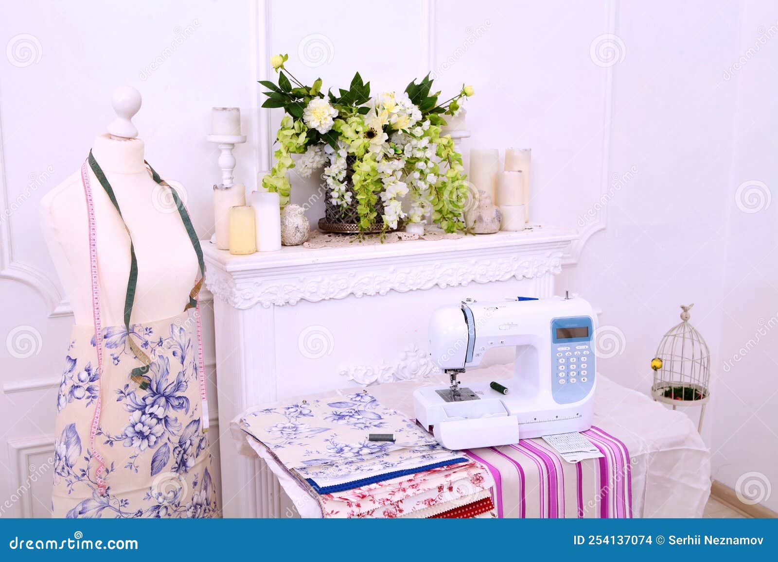 Composition from a Sewing Machine. Mannequin, Flowers on a Retro Table