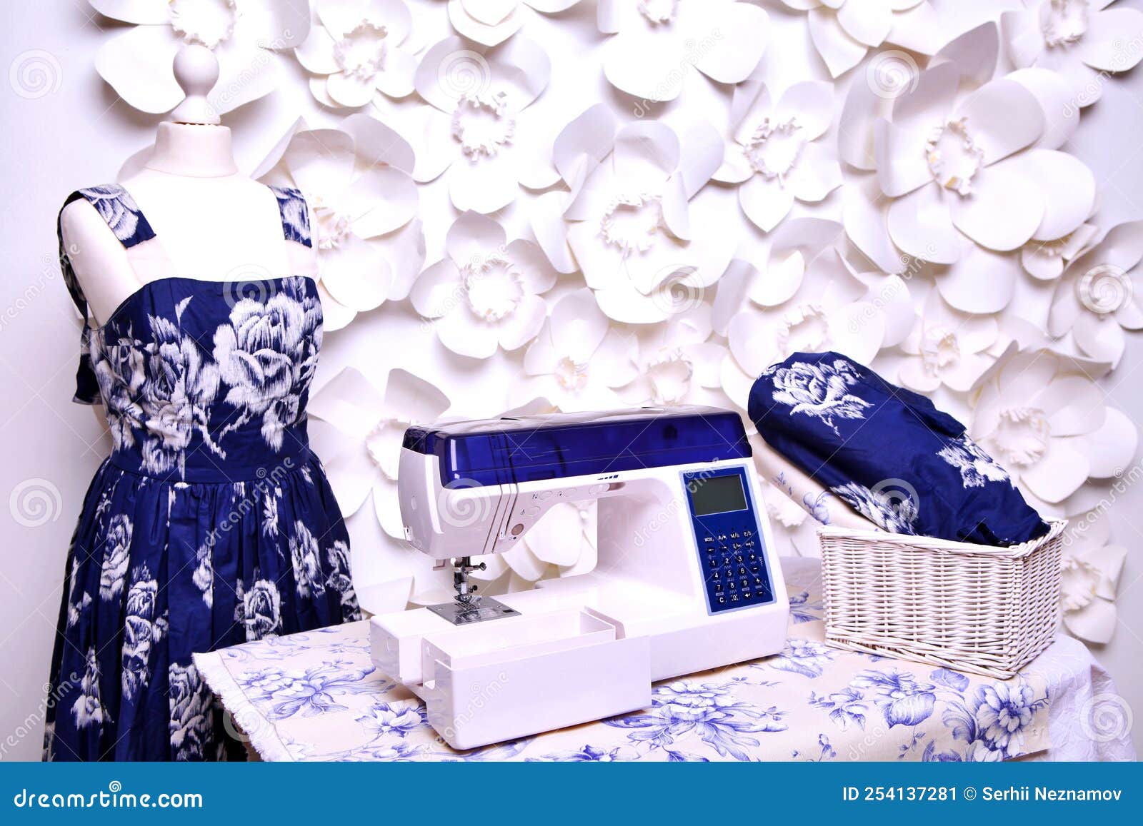 Composition from a Sewing Machine. Mannequin, Flowers on a Retro Table