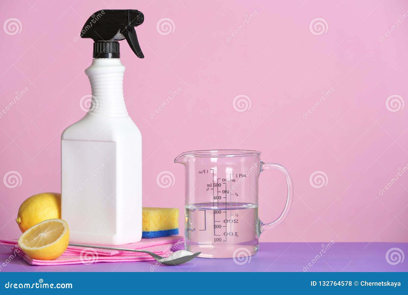 Composition with Vinegar and Cleaning Supplies on Table. Stock Photo