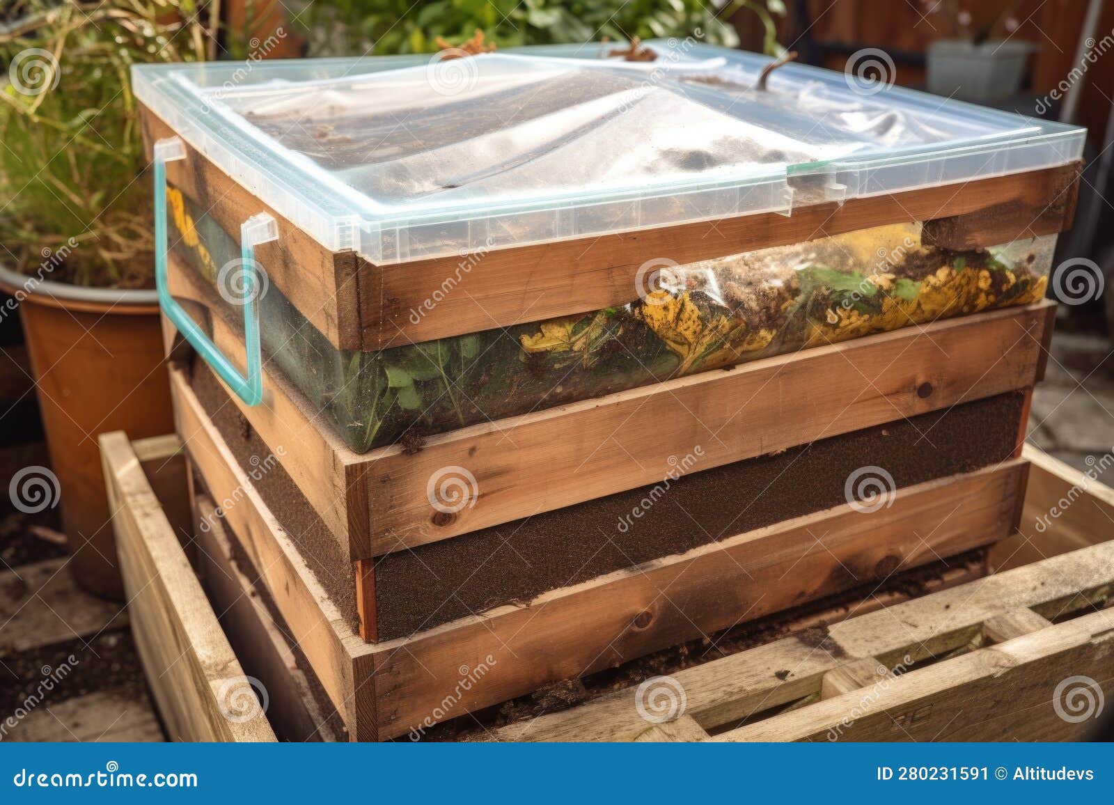 Compost Bin with Clear Lid, Showing the Layers of Composting Materials