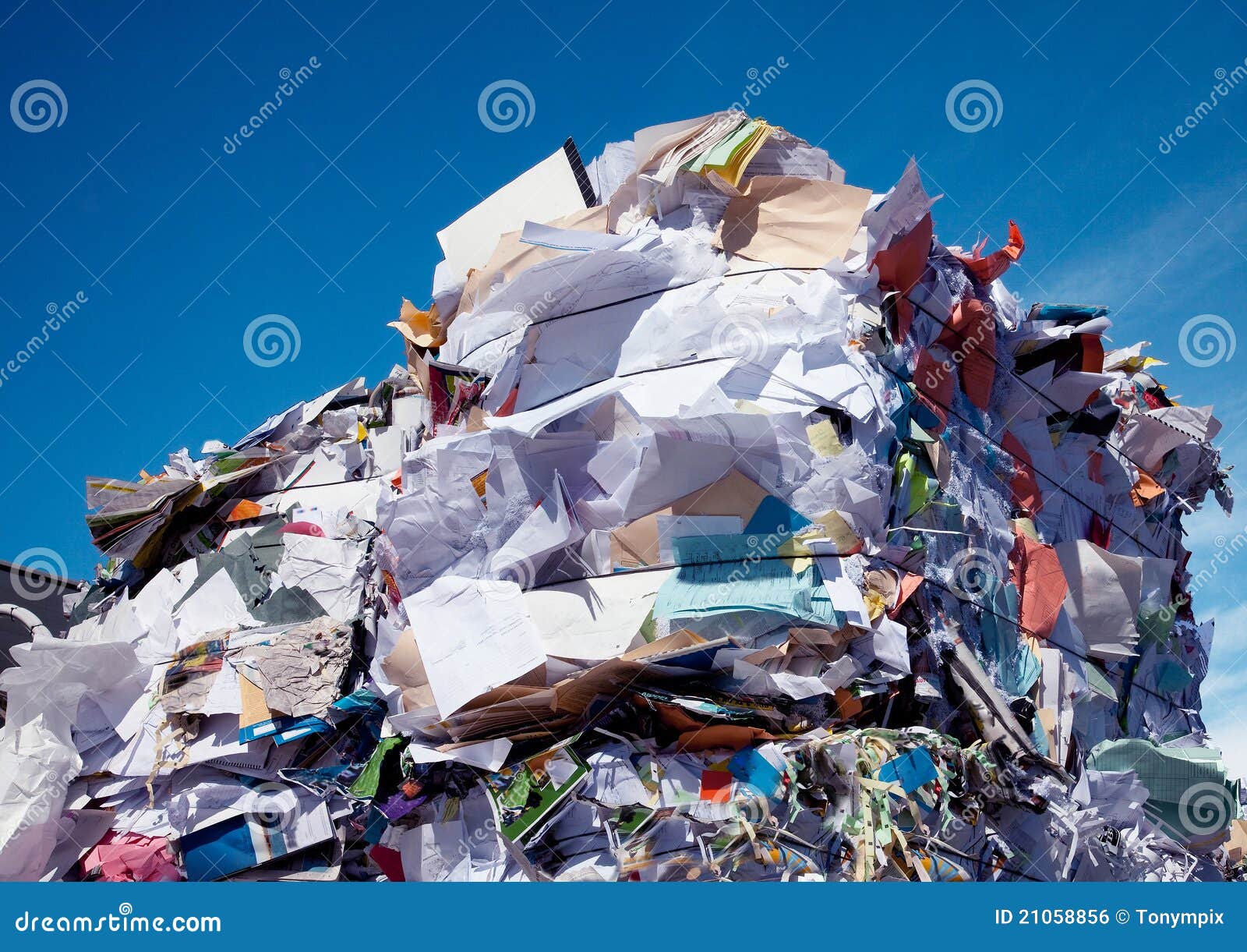 compressed blocks of paper at recycling plant
