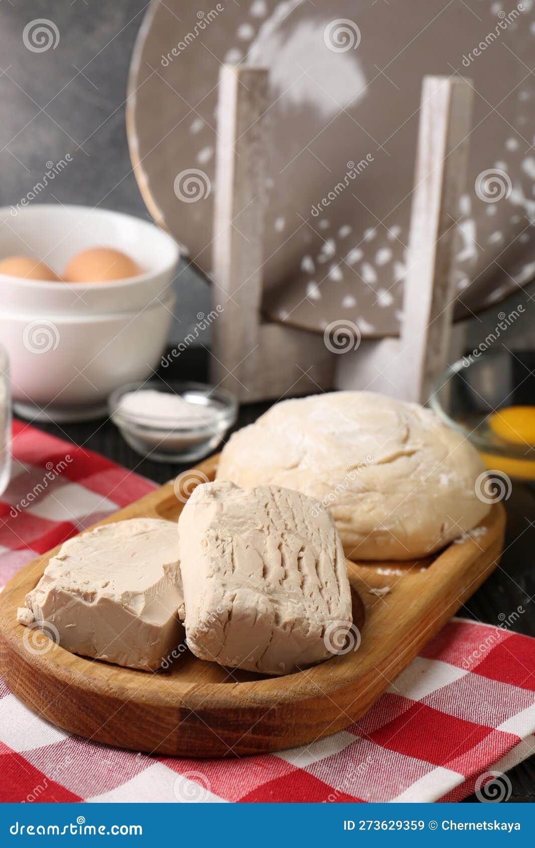 Compressed Yeast, Salt, Eggs and Flour on Wooden Table Stock Image