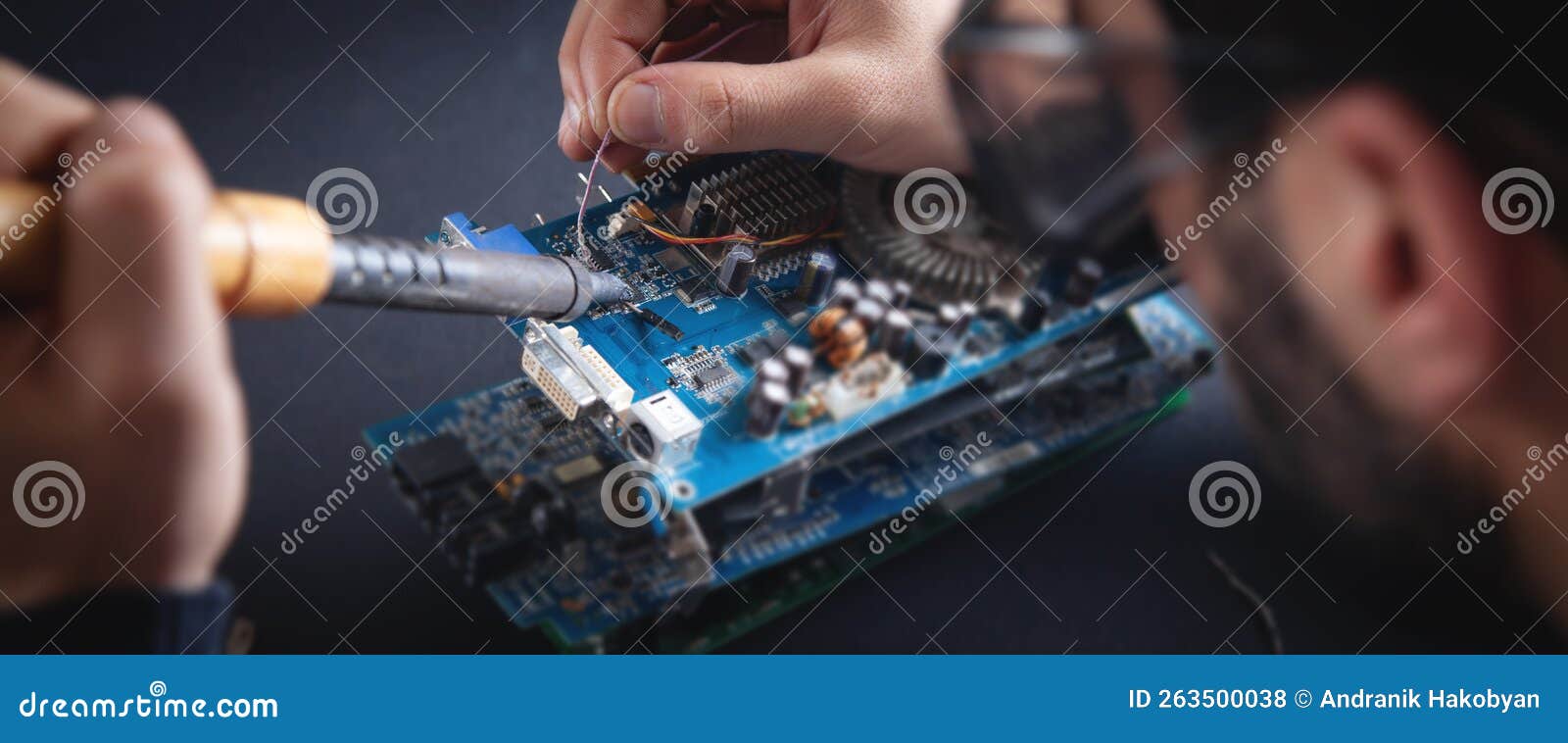 Computer Hardware Engineering. Engineer Soldering Computer Motherboard