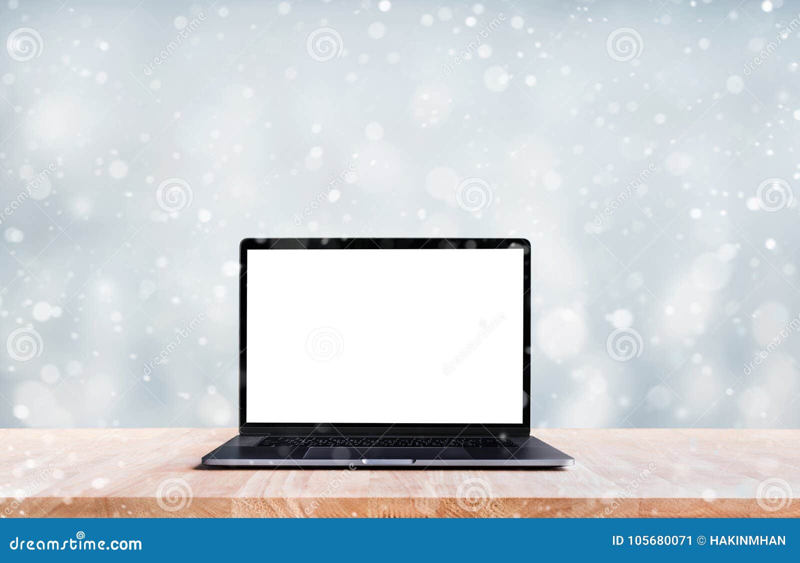 computer,laptop with blank screen on snowfall in winter season